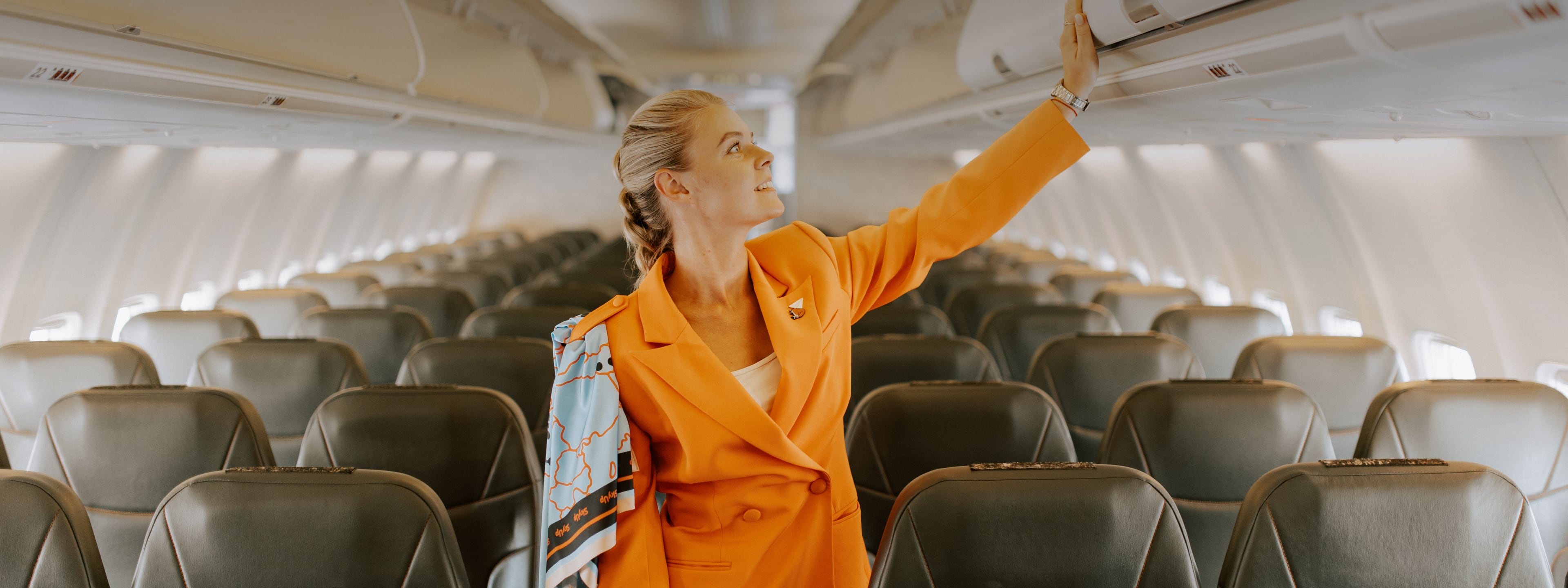 A flight attendant on board an airplane